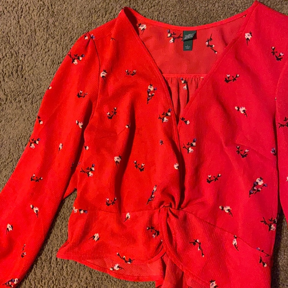 red floral v-neck blouse